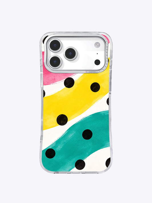 Clear iPhone 17 Pro Max case with broad yellow, teal, pink, and white brush bands and scattered black dots