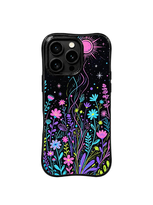 Black iPhone 16 Pro case with neon pink, blue, purple, and green wildflowers beneath a pink moon and stars