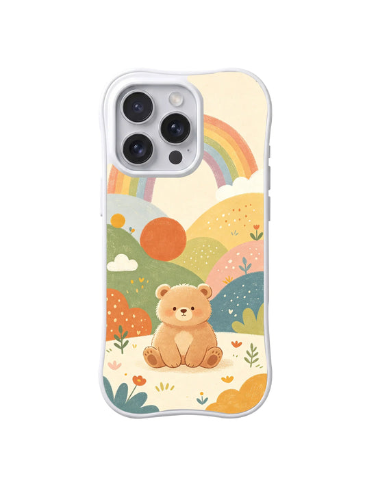 Clear iPhone 14 Pro case with a seated tan bear, pastel rainbow, layered hills, sun, flowers, and clouds