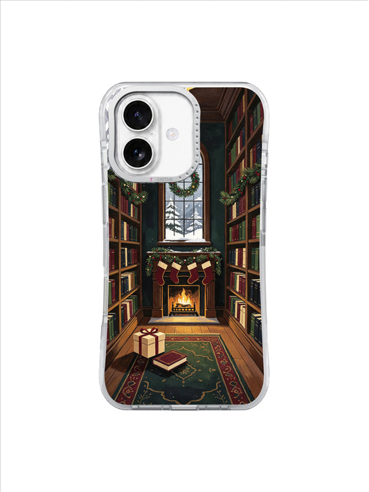 The Library After Snowfall iPhone 17 case with tall bookshelves, glowing fireplace, gift and returned book