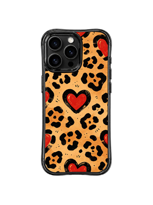 PhoneCasing iPhone 14 Pro Case, Western Heart Leopard hand-drawn watercolor print by Roxy Wildhart. Warm caramel desert base, rough brushstroke black leopard spots, bold vintage red cowboy embroidery hearts, wavy black glossy bumper, retro western feminine aesthetic for daily styling.