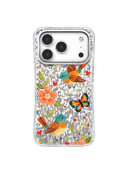 Orange birds, butterflies, flowers, and leafy stems on a clear iPhone 17 Pro case.