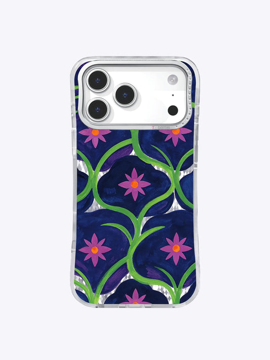 Clear iPhone case with repeating green looped stems and magenta star-shaped flowers on navy