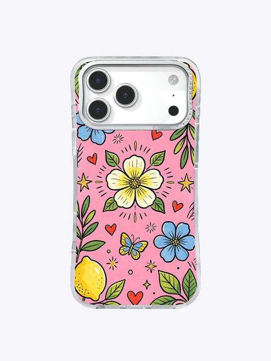 Clear iPhone 17 Pro Max case with one yellow lemon, large yellow and blue flowers, leafy stems, butterflies, hearts, and stars on pink