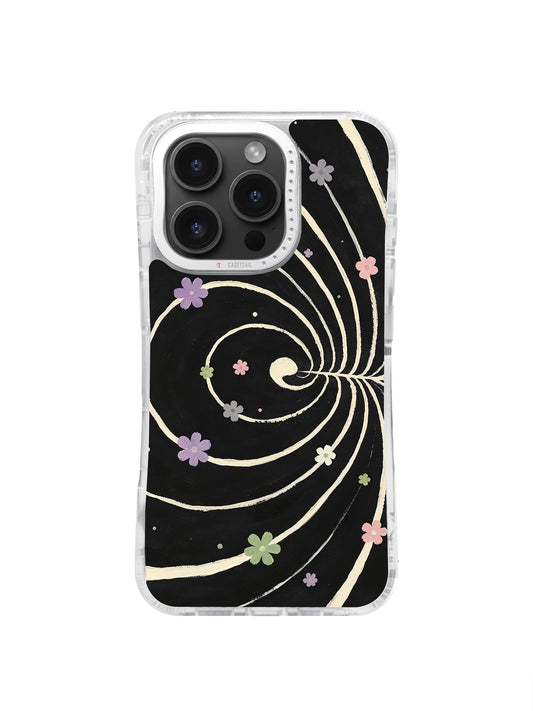 Pastel flowers along cream spiral paths on a black iPhone 16 Pro Max case.
