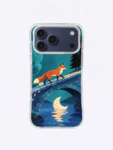 Burnt-coral fox and cream-tipped tail above a crescent reflection in a cobalt river