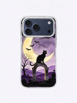 Golden-eyed black cat and crescent moon above lavender cemetery hills on an illustrated iPhone case