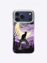 Black cat standing on a moon-shaped stone arch beneath a pale crescent on the Moonlit Sentinel iPhone case
