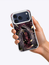The Raven and the Brass Key illustrated iPhone case held in one hand