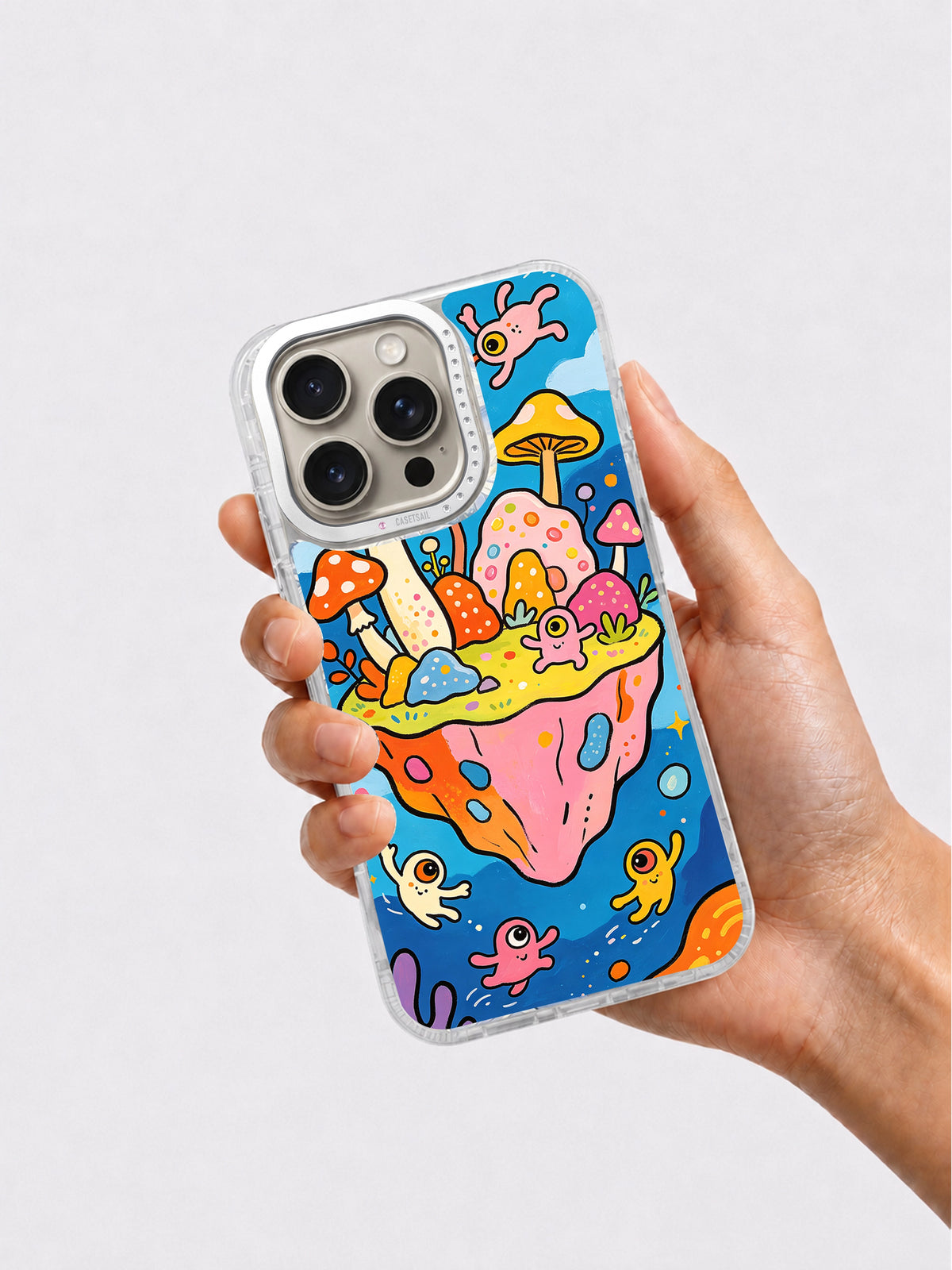 Hand holding mushroom island art iPhone case