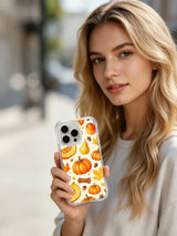 Golden Pumpkin Harvest Celebration: A person holds the illustrated case in an outdoor portrait.