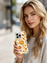 Autumn Orchard Blessings: A person holds the illustrated case in an outdoor portrait.