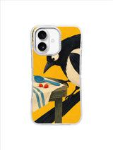 Diagonal magpie tail framing a blue spoon, berries and striped cloth on an iPhone 17 case