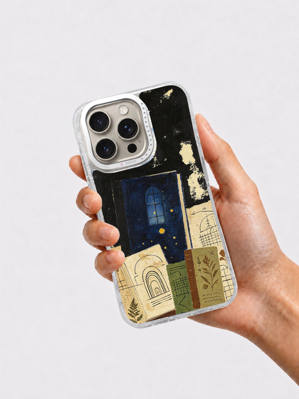 Hand holding dark academia iPhone 16 Pro case