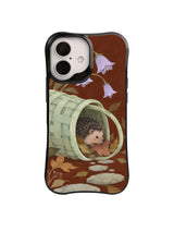 Hedgehog sheltering inside a basket beside lilac flowers and pale stones on a dark case design