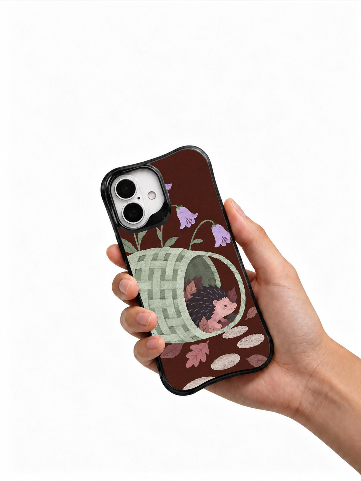 After the Basket Emptied hedgehog iPhone 16 case shown naturally in hand