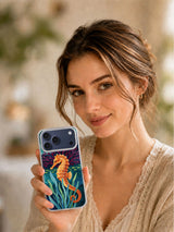 Lifestyle view of a woman holding the Amber Seahorse Reef iPhone case