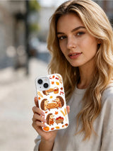 Apple Pie Hedgehog Parade: Person holding the illustrated case in an outdoor portrait.