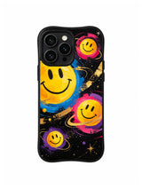 Cosmic Confidence Orbit: Three yellow smiley faces in turquoise, pink and gold rings float on black.