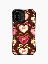 Ribbon Heart Keepsakes: Large ribbon-tied hearts in pink, cream and brown form a spaced pattern.