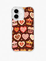 Carousel Cookie Parade: Small carousels alternate with iced heart cookies and candy-like motifs.