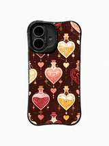 Ornate Love Elixirs: Heart-shaped potion bottles in cream, pink, red and gold hang on dark brown.