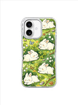Clover Nap Bunny Grove: Sleeping bunnies rest in dense clover with flowers, logs and a small snail.