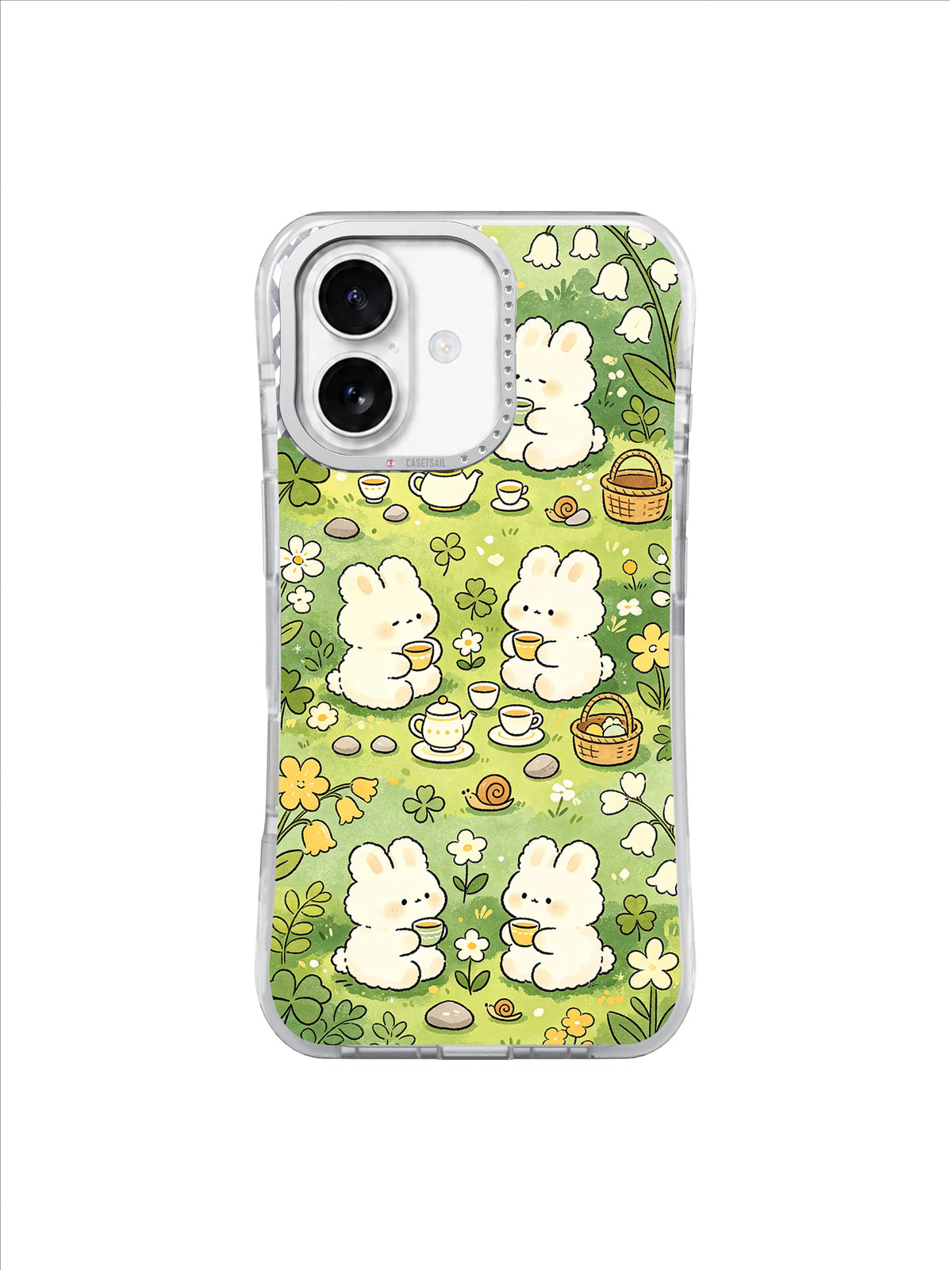 Clover Bunny Tea Picnic: Cream bunnies share teacups in a green clover meadow with yellow flowers and baskets.