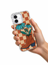 Wildflowers Borrow a Boot iPhone 17 Case hand-held lifestyle view