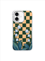 Asymmetric lily of the valley stems framing an open checkerboard window