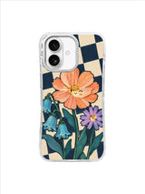 Turquoise campanula beside an apricot flower and purple aster on a checkerboard iPhone 17 case
