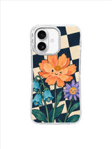 Friendly apricot cosmos and violet star flower rising above broad teal leaves on navy checks