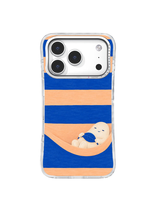 Warm ivory creature resting in an apricot hammock between cobalt stripes on an iPhone 17 Pro case