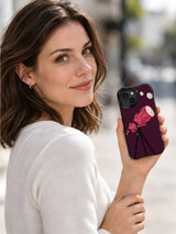 Woman displaying the Dragon Fruit Telescope black iPhone case