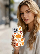 Cozy Hearth Harvest: A person holds the illustrated case in an outdoor portrait.