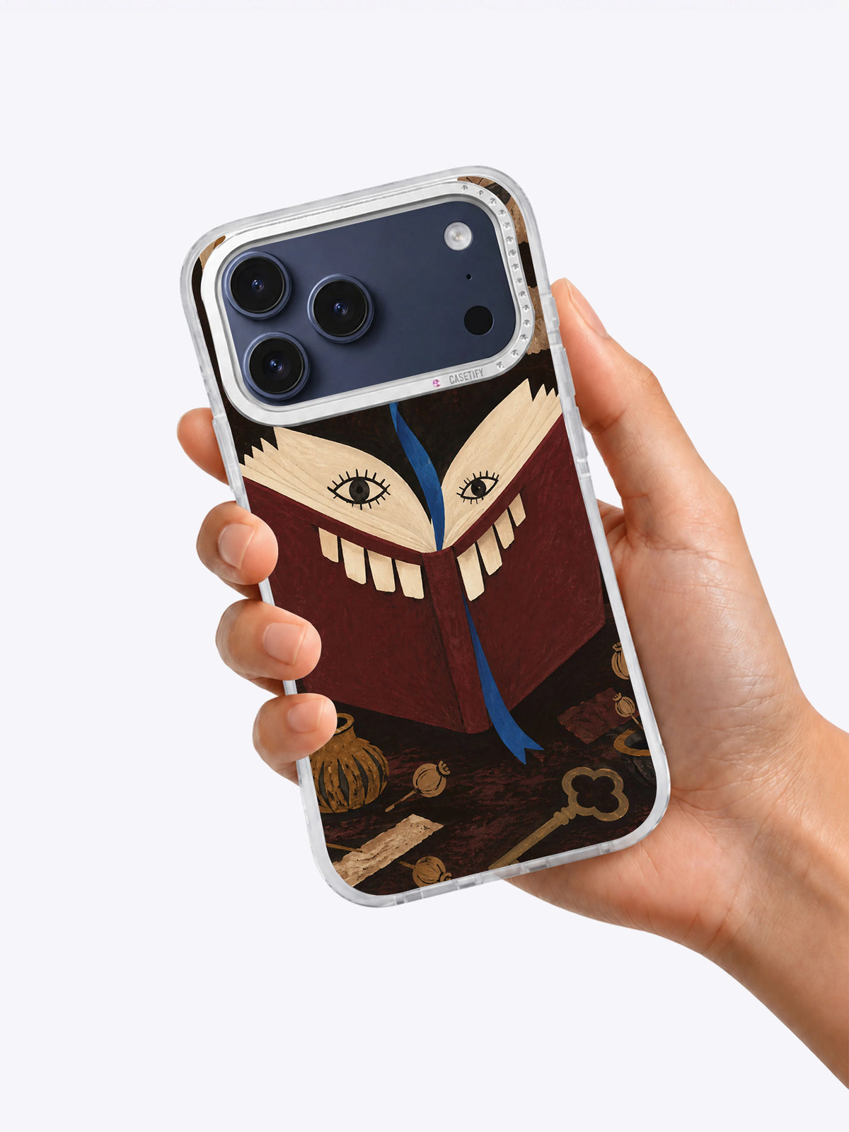 The Book That Ate the Silence iPhone 17 Pro Max Case shown in hand