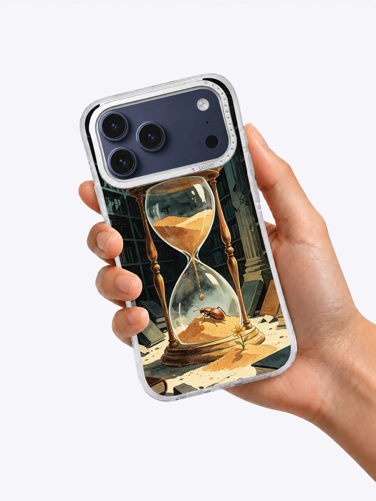 The Beetle and the Hourglass illustrated iPhone case held in hand