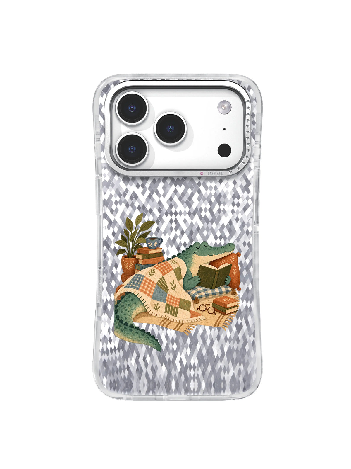 Crocodile reading beside a cooling dusty-blue tea cup and books in a cozy phone case design.