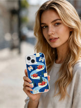 Woman holding the Blue Ice Holiday iPhone 15 case