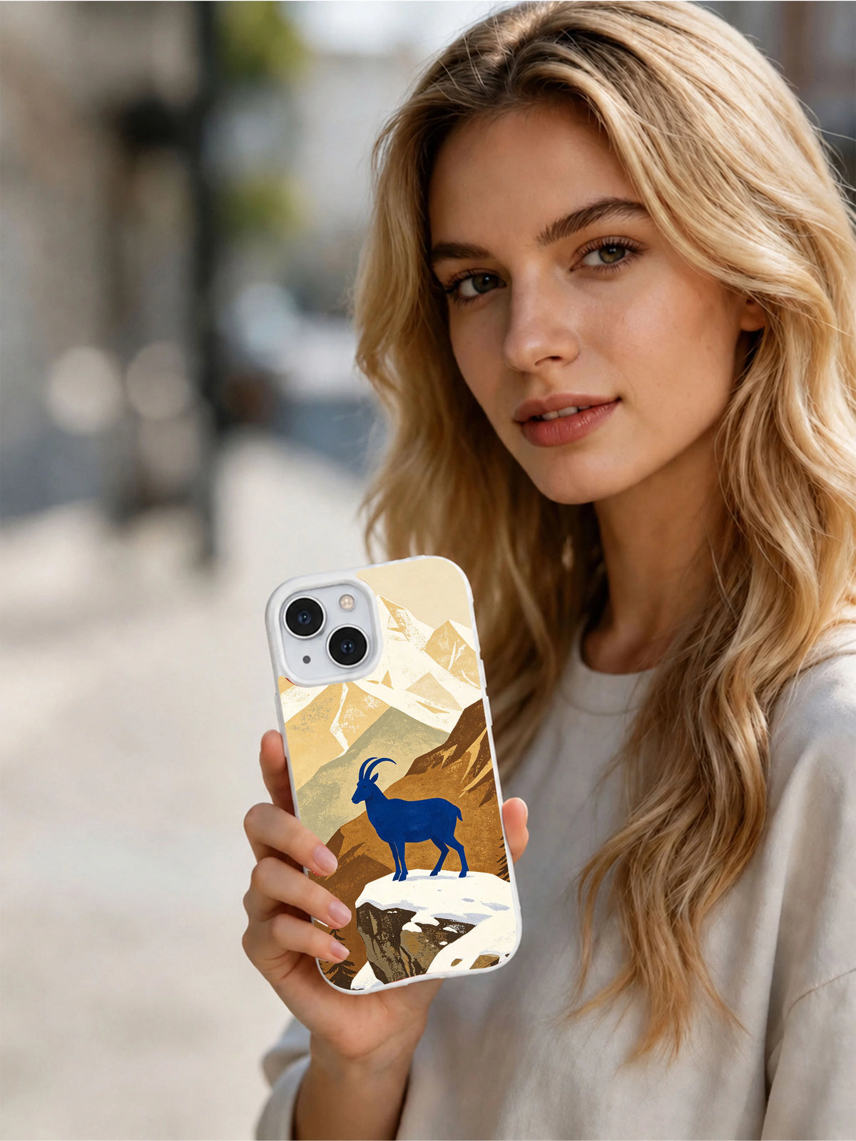 Blue Mountain Goat iPhone 13 case shown in a lifestyle portrait
