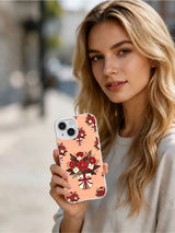 Woman holding the Blush Holiday Bouquet iPhone 15 case