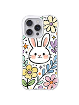 Blushing Bunny Flower Field: A large white rabbit face appears among yellow, pink and blue flowers.