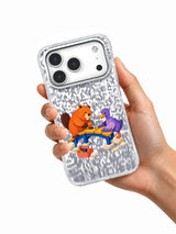 Hand holding a transparent iPhone 17 Pro case with orange beaver, violet duck, and blue bridge artwork
