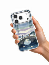 The Bridge Where Wishes Met iPhone case held in hand