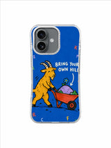 Yellow mountain goat carrying a lavender hill and blue flower in a red wheelbarrow