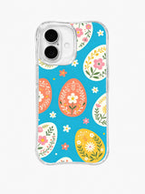 Bunny Garden Without Bunny / Coral Egg Scatter: Large coral, cream and yellow eggs filled with floral motifs, scattered among small blossoms on bright turquoise.