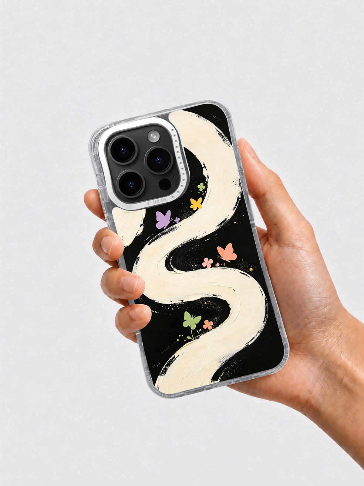 Butterfly Memory Garden phone case held in hand