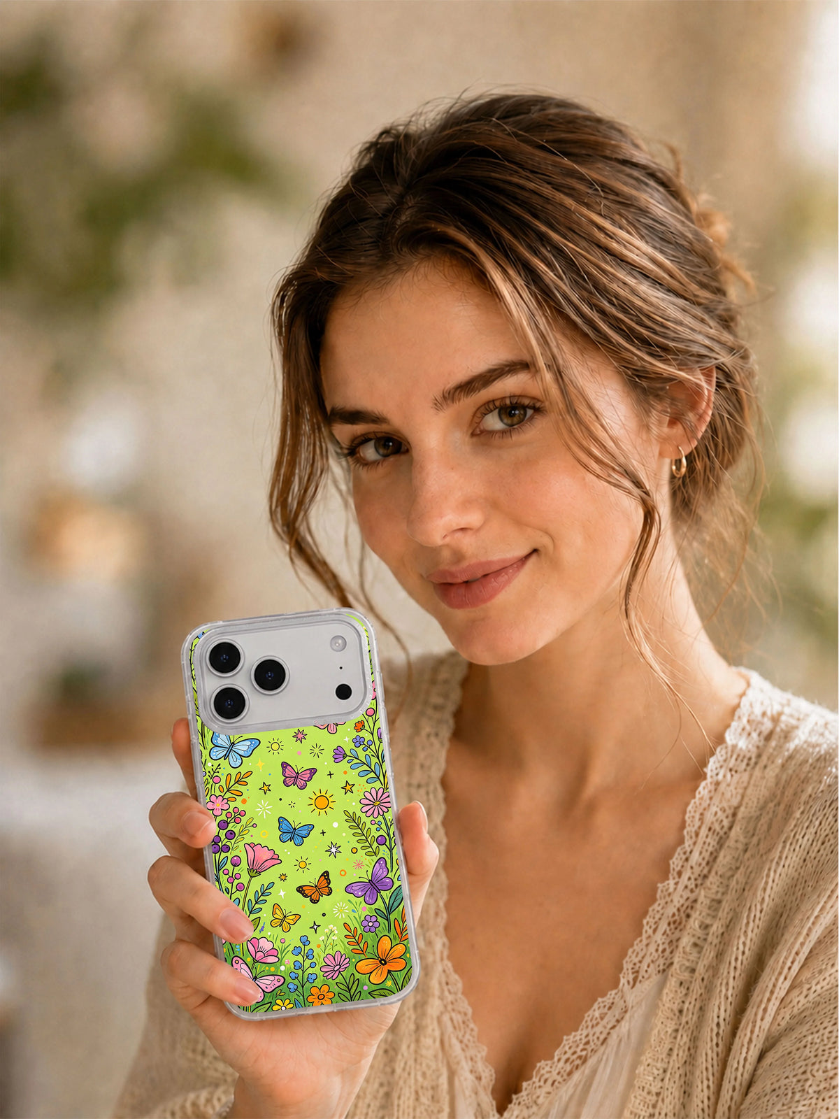 Butterfly Secret Meadow iPhone 17 Pro Max case held in hand
