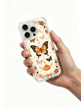 Butterfly Spell Harvest iPhone 14 Pro case held in hand