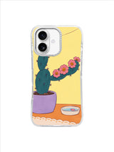 Dark teal cactus accepting a soft pink flower garland in a lavender pot